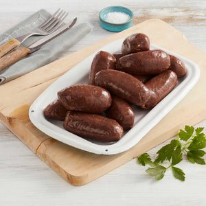 Morcillas Marca Sagal Servidas sobre un Plato con Cubiertos y Sal